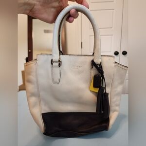 Used Coach tan,‎ purple and yellow handbag
